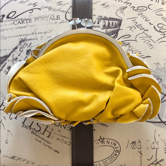 Yellow leather wave clutch with coin purse closure